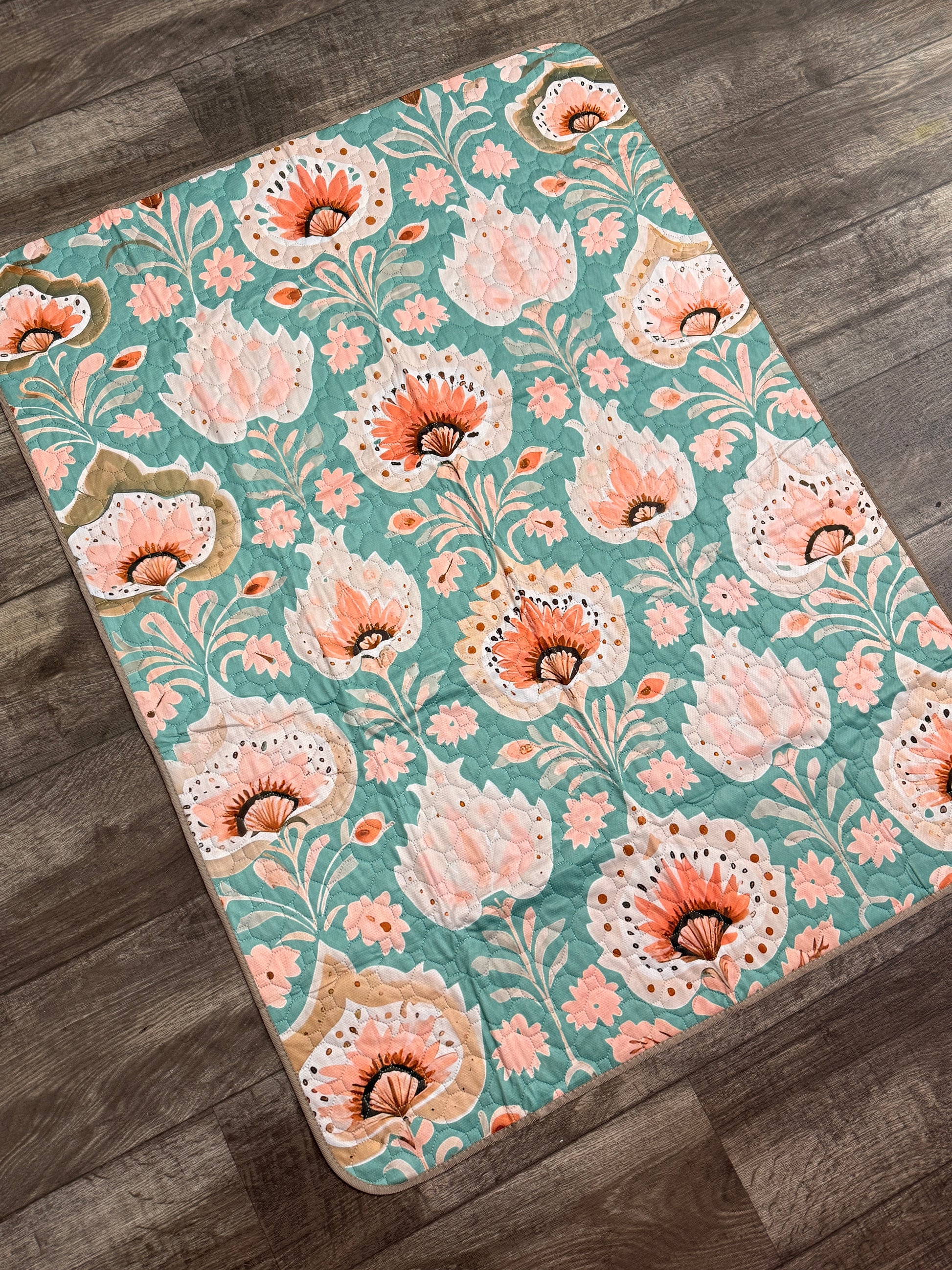 Floral patterned rug on a wooden floor